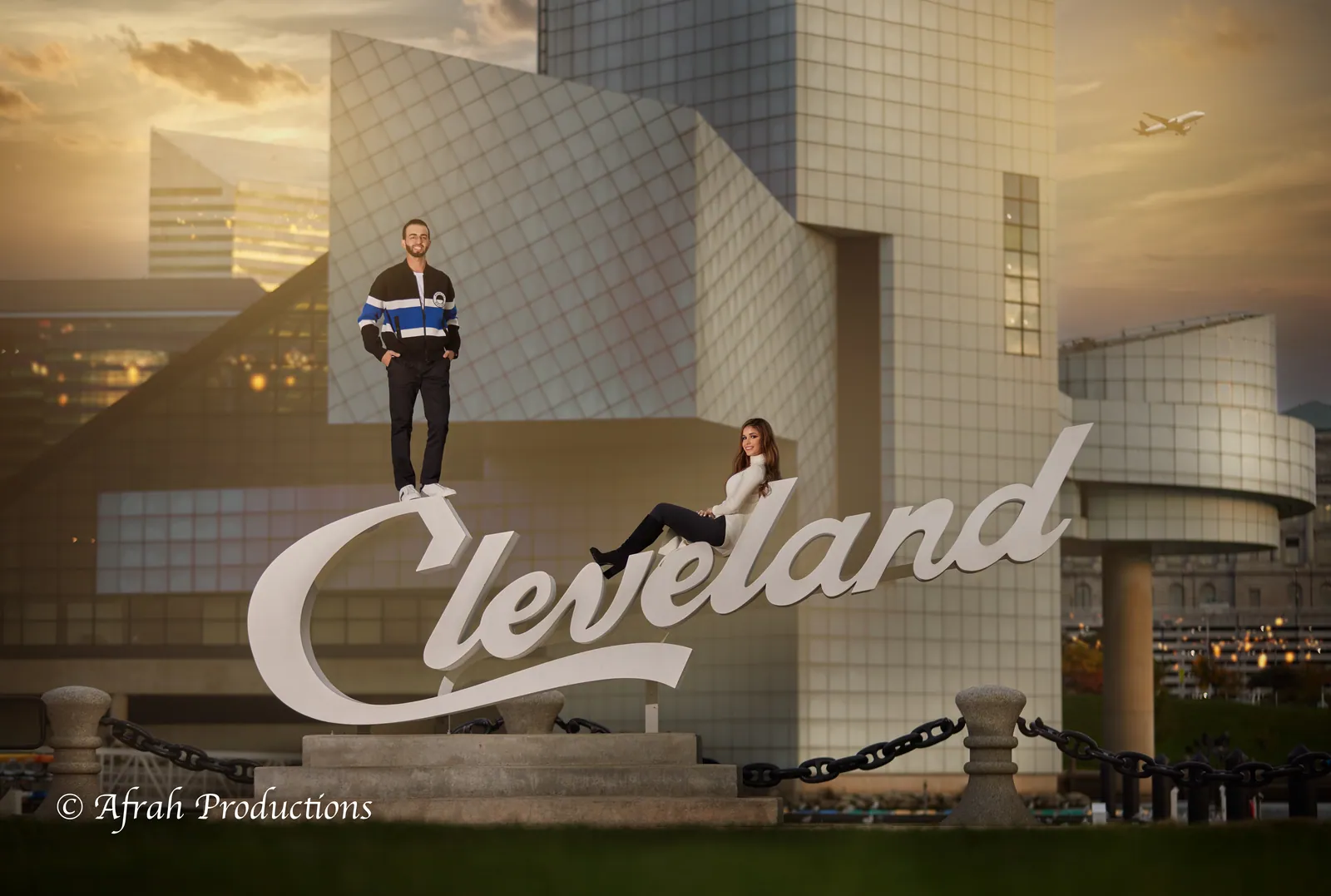 Couple on the Cleveland sign by the lakefront