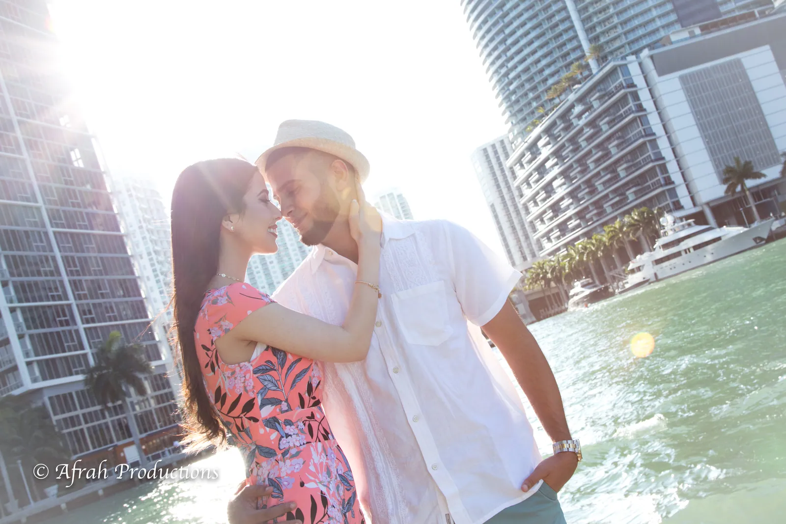 Couple on the bay with the Miami skyline behind them